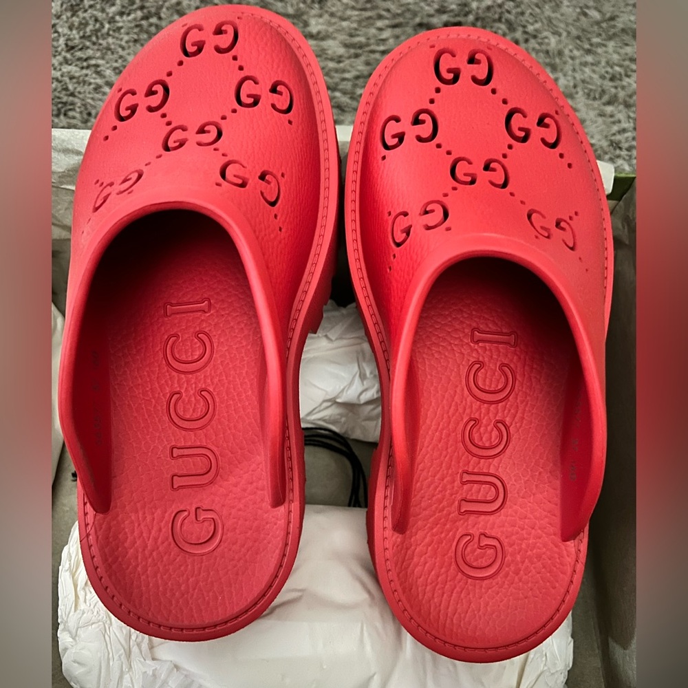 Red Gucci rubber clogs